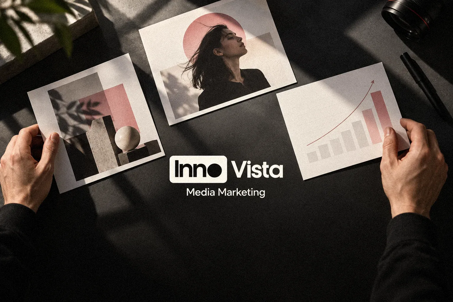 Innovista Media: the InnoVista Media Marketing mark over printed campaign photos on a desk